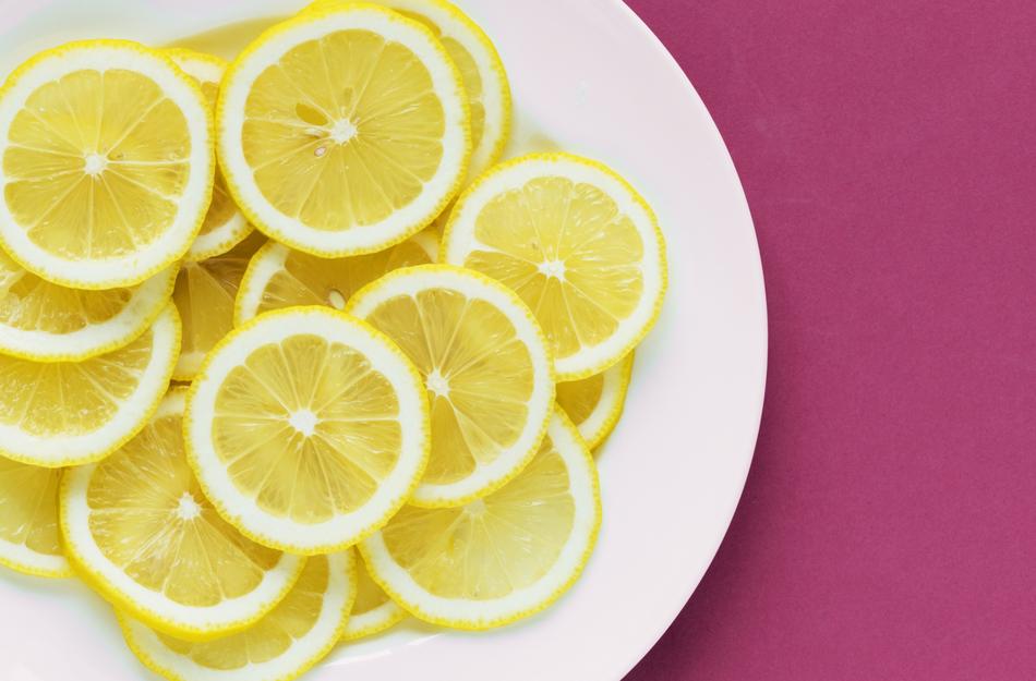 sliced lemon on the white plate