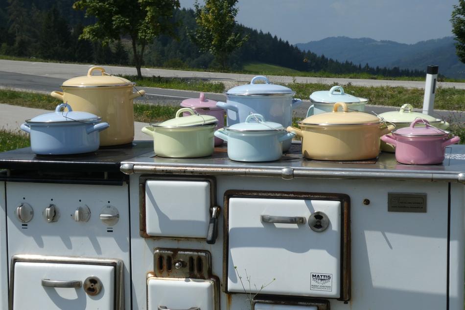 vintage colorful pans on Stove outdoor, austria