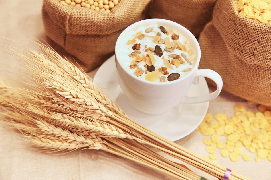 wheat near a cup of oatmeal