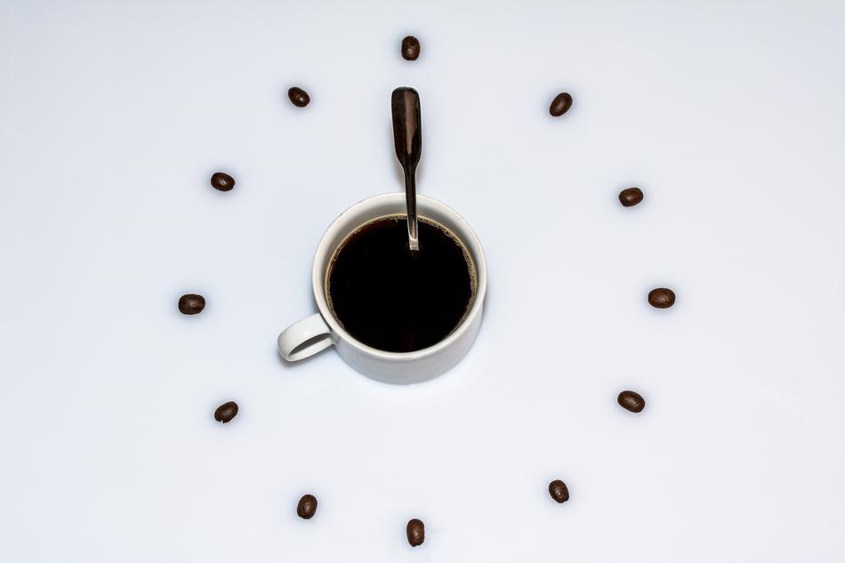 watch with a cup of coffee and coffee beans