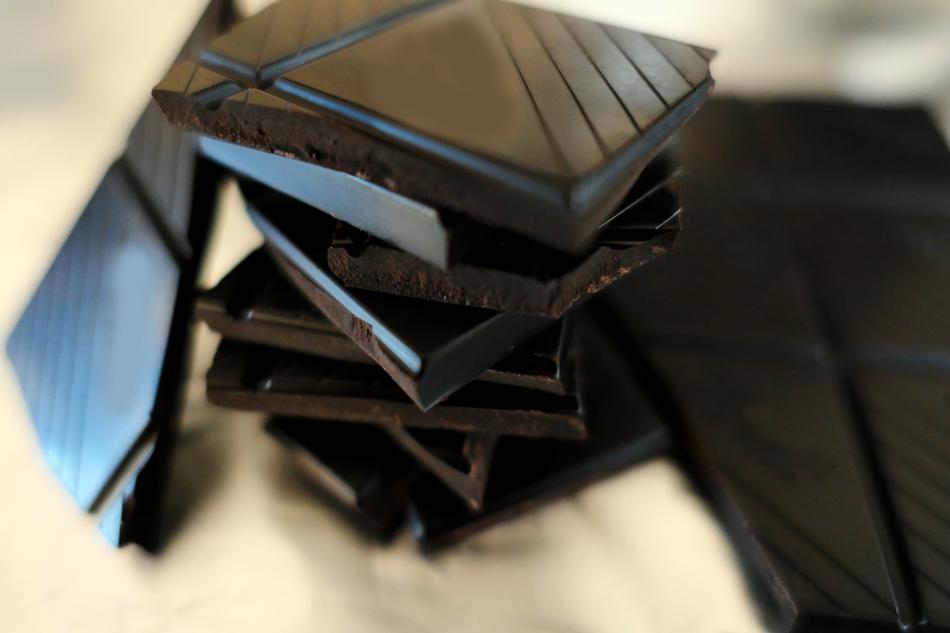 Close-up of the stack of the beautiful, sweet, shiny chocolate in light