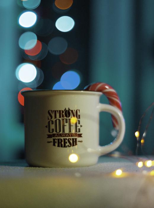 cup with coffee drink on blurred background