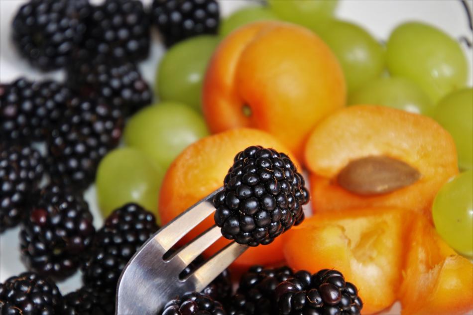 variety of berries and fruits close-up on a blurred background