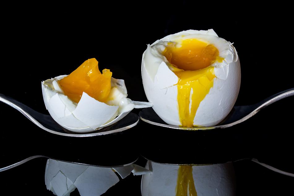 egg halved in spoons