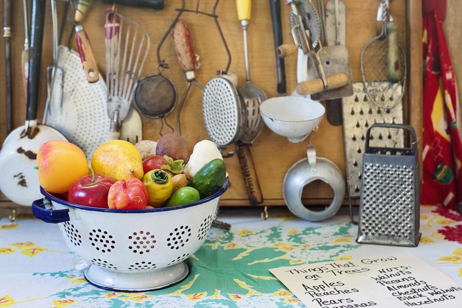Colorful vegetables in the bowl among the kitchen tools