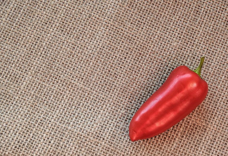 red pepper on a canvas tablecloth