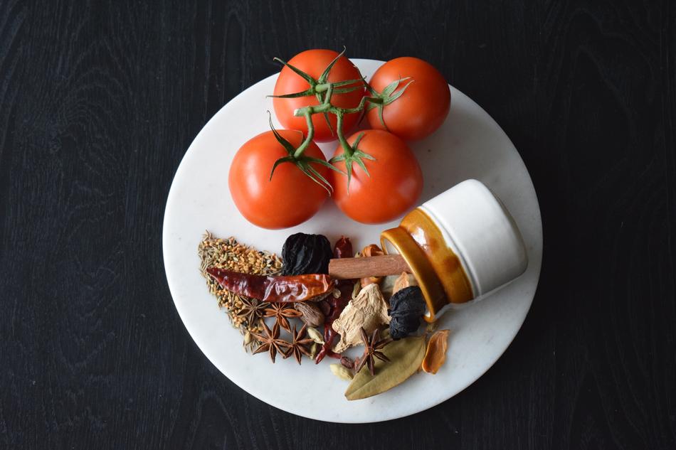 tomatoes and indian seasonings on a plate