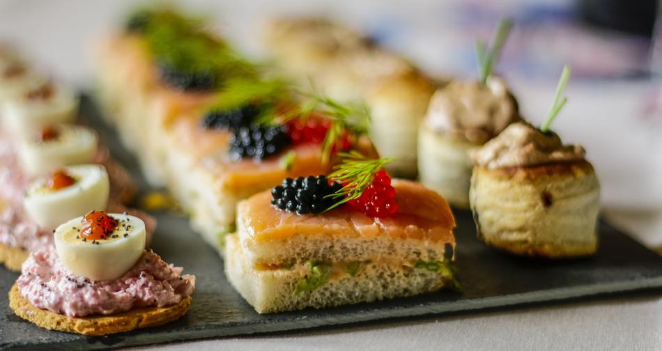 canapes with mushrooms, salmon and shrimp in a restaurant