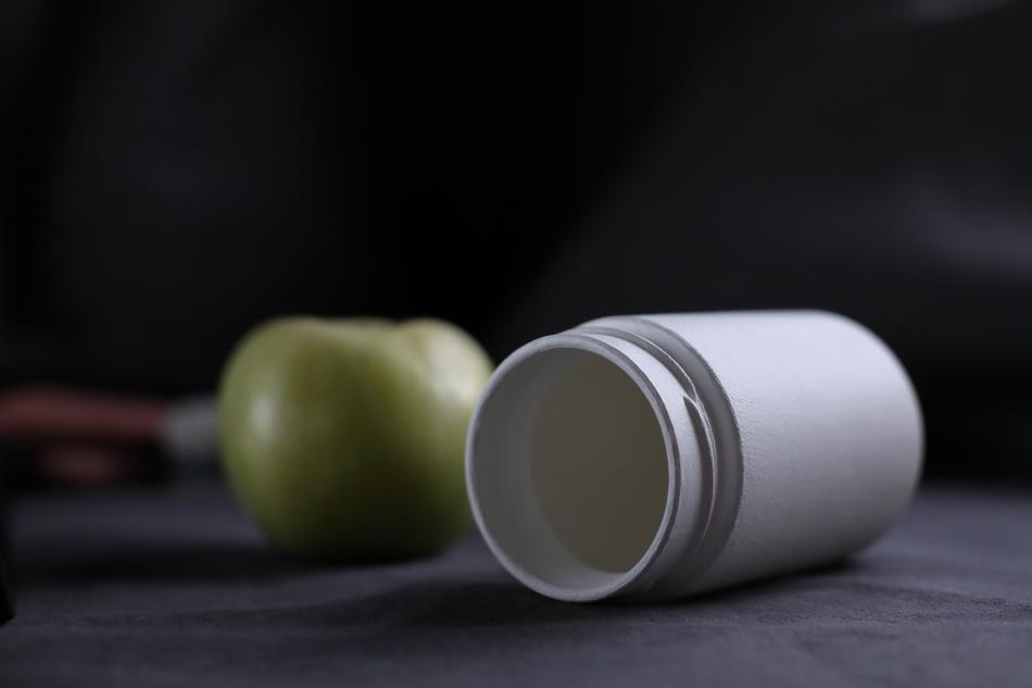Apple and white bottle