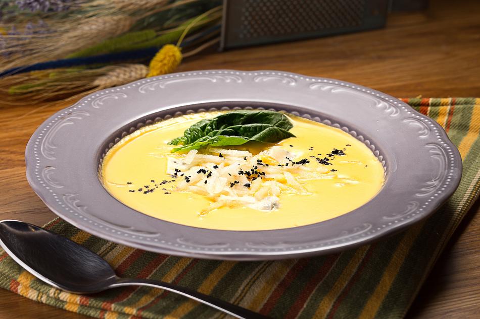 cheese soup in a silver plate