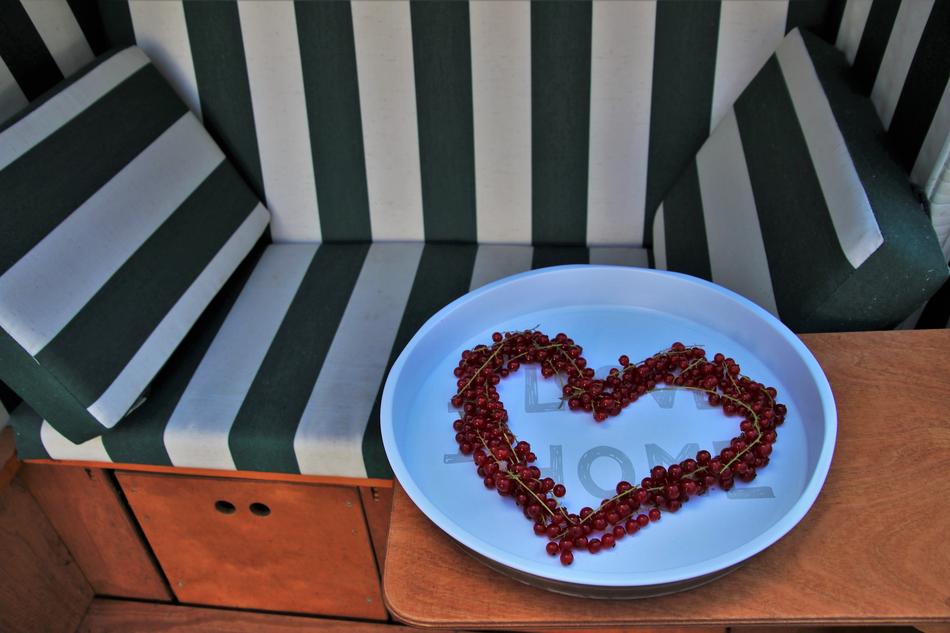 heart shape dessert on plate in front of seat
