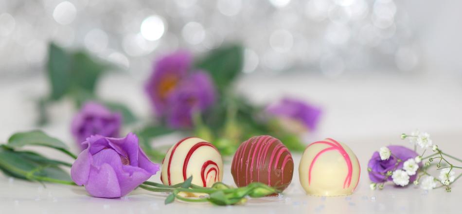 chocolates near purple flowers