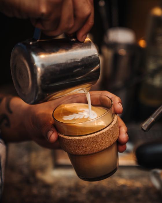 barista preparing latte