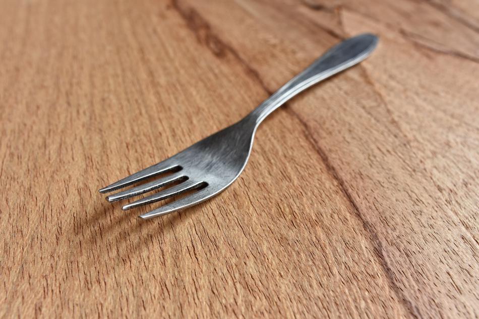 Fork on wooden surface