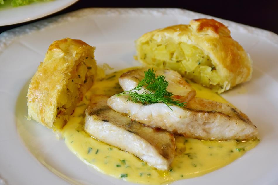 zander fillet and potato strudel on a plate