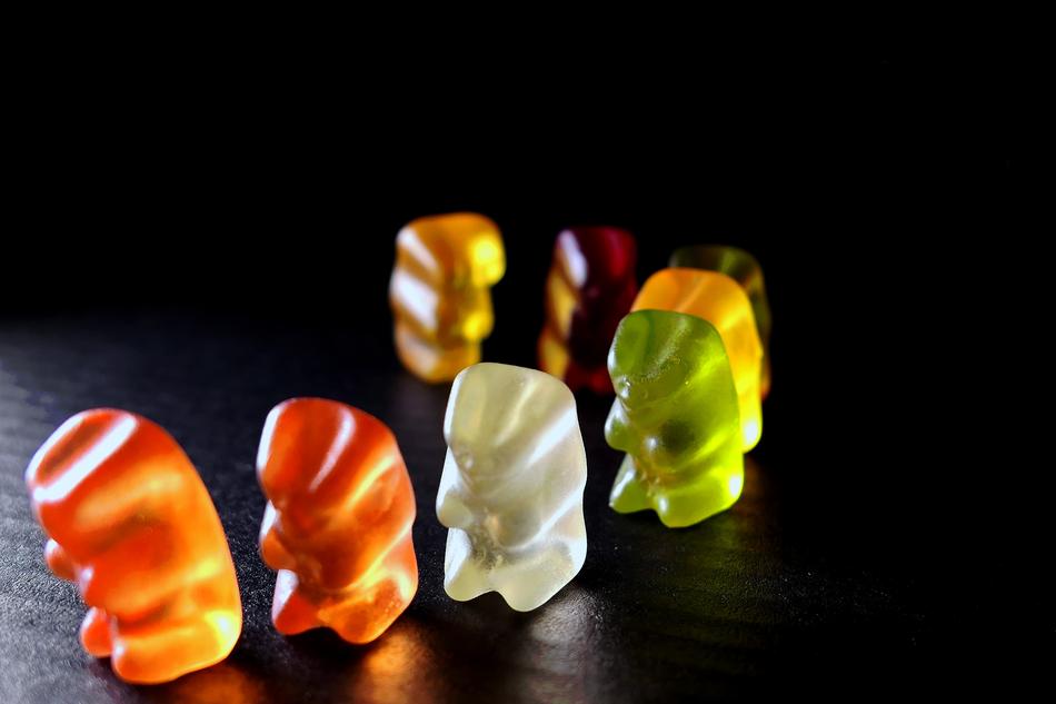 Colorful candy bears at dark background
