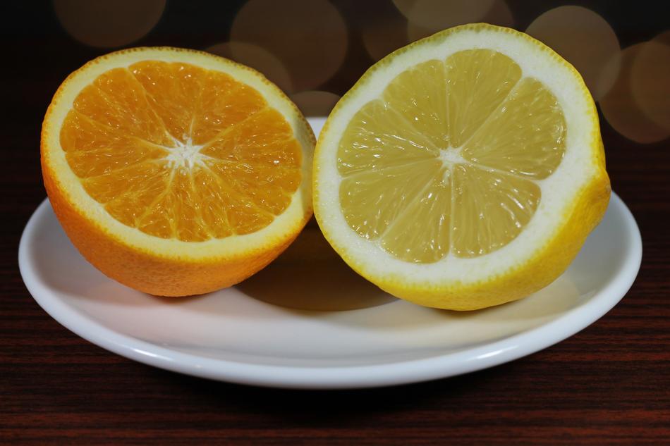 Lemon and Orange, cut fruits on saucer