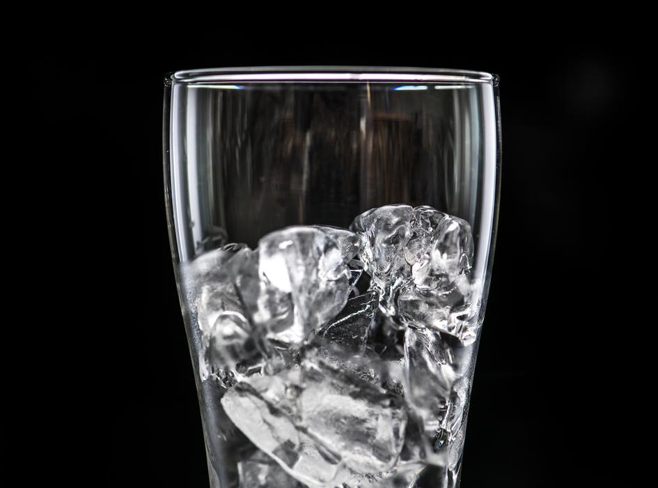 Beverage with ice cubes at Black Background