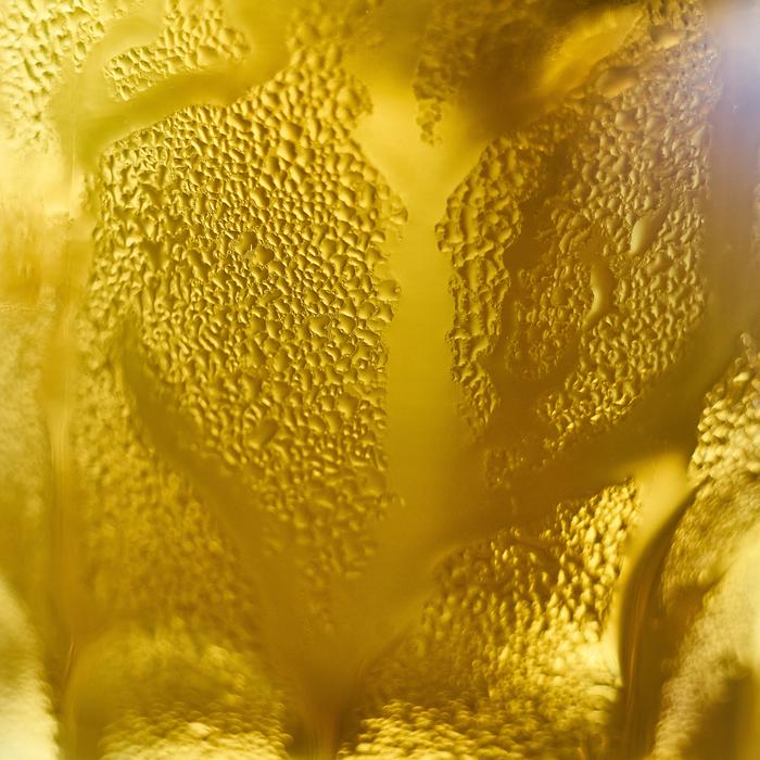 Macro photo of cold beer in a glass