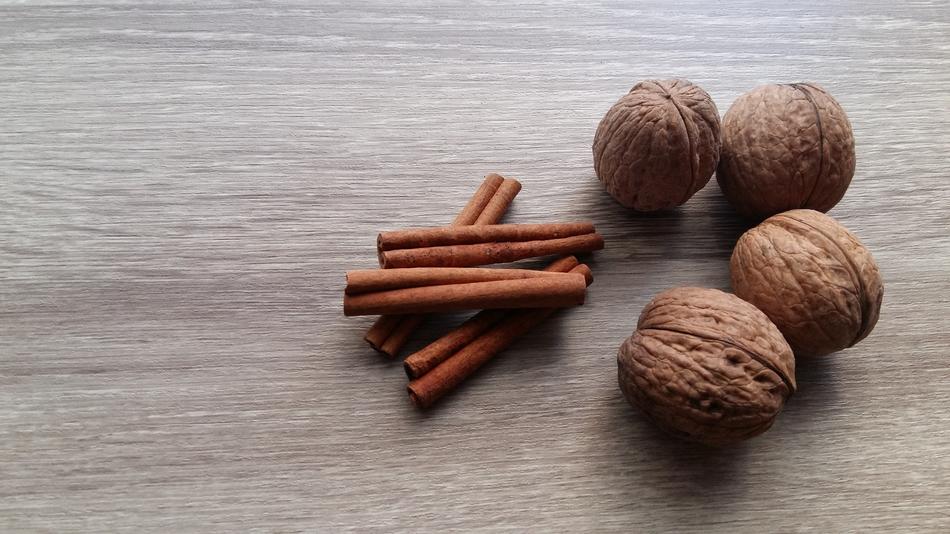 cinnamon sticks and walnuts on the table