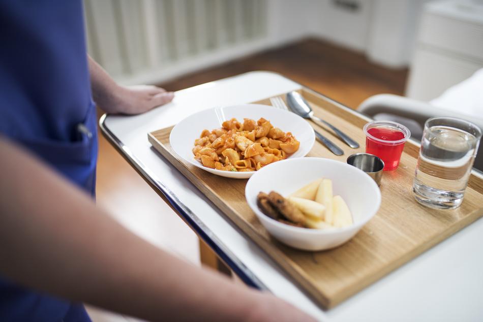 Lunch on a wooden board in a hospital