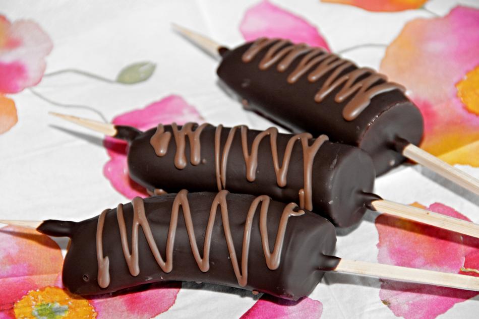 Beautiful dessert bananas as chocolate spit