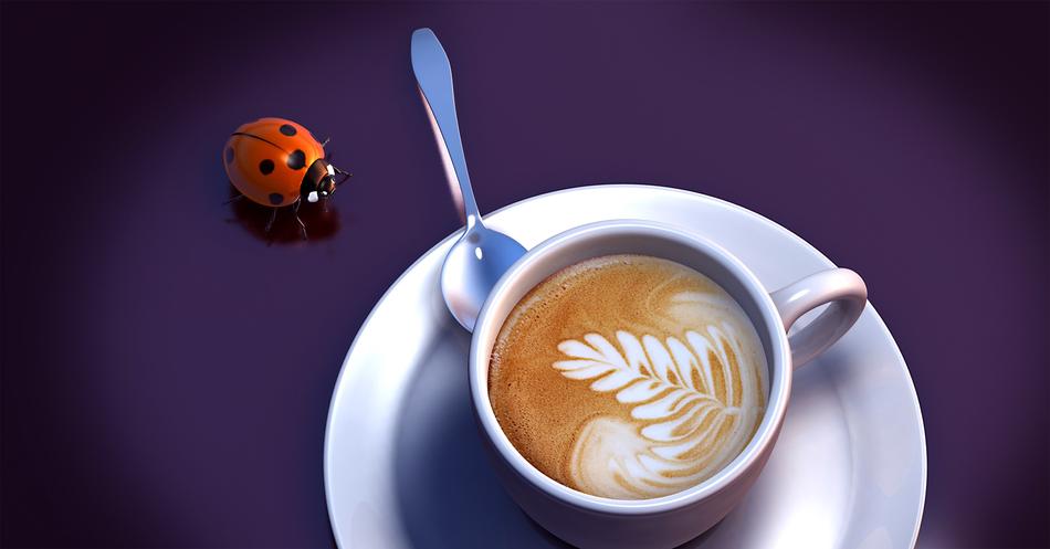 a cup of cappuccino and a ladybug on a purple table