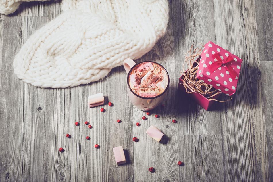 Gift and cup on Wooden Table