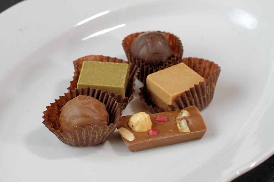 Praline Chocolates with nuts on plate