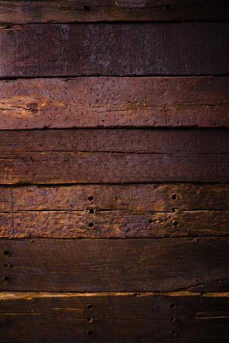 Texture of the beautiful coffee-colored wood wall