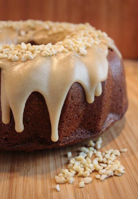photo of a round cake with white frosting