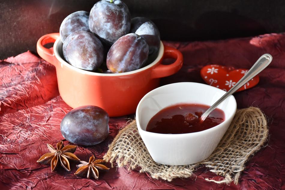 ripe plums and plum jam on the table