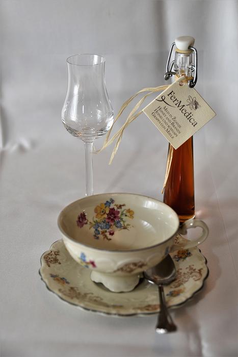 tea couple, glass and liquor on the table