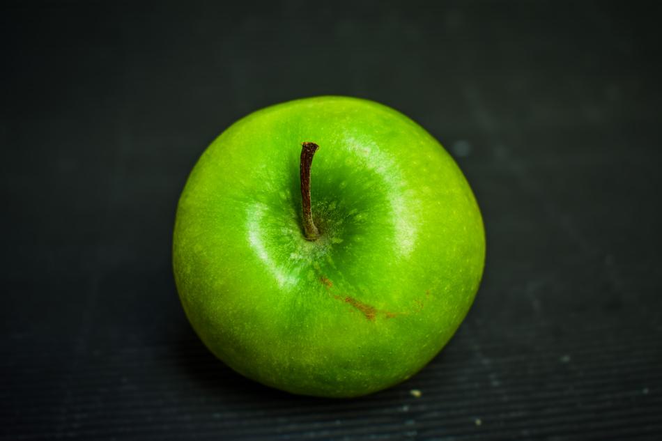 Green Apple at black background