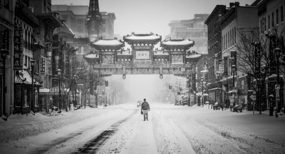 man in a blizzard in Chinatown