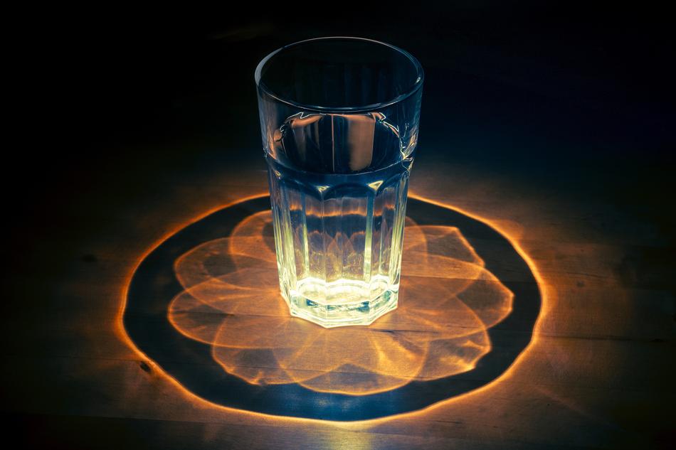 water in a glass on a kaleidoscope