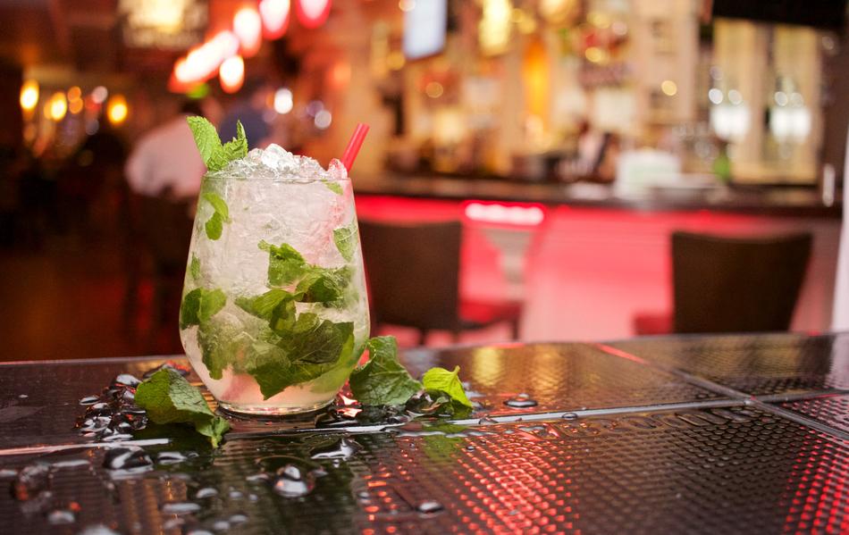 mojito with ice and mint on the bar table