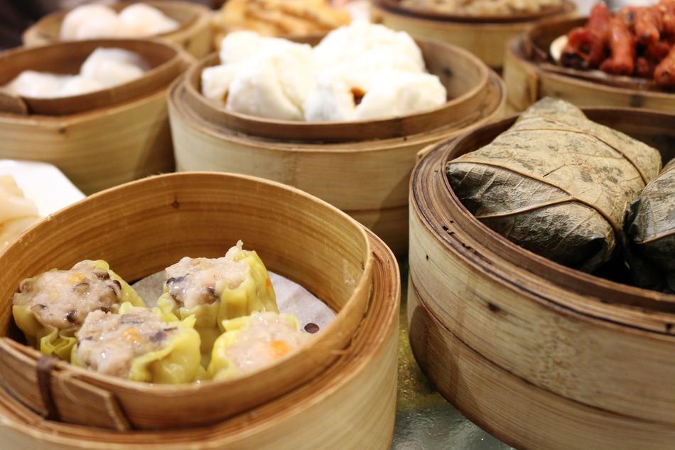 Colorful and beautiful Dim Sum dishes in the wooden bowls, in Hong Kong