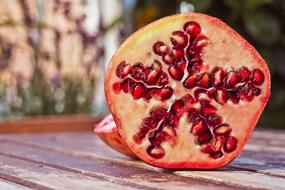 closeup photo of juicy red Pomegranate Fruit