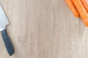 large knife on a wooden cutting board