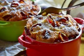 Colorful and beautiful plum cakes in the colorful bowls