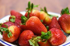 delicious red Strawberries on white plate