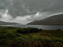 dramatic sky over fjord in ireland
