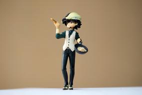 figurine of a japanese boy with a frying pan