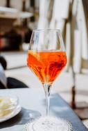 wine in a glass on a table in a restaurant on a blurred background