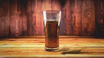 Beer on a wooden table close up