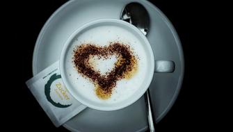 heart shaped cinnamon on coffee