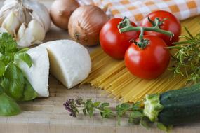 mozzarella, tomatoes, garlic, zucchini on the table