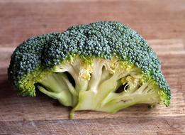 Close-up of the green and yellow broccoli vegetable on the wooden surface