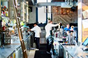 bartenders prepare drinks in the restaurant